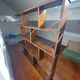 Asymmetrical wall or divider bookcase in dark wood