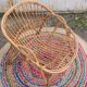 Fauteuil vintage « coquille » en rotin