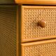 Dresser and its bedside table in cane rattan and vintage oak from the 1970s.