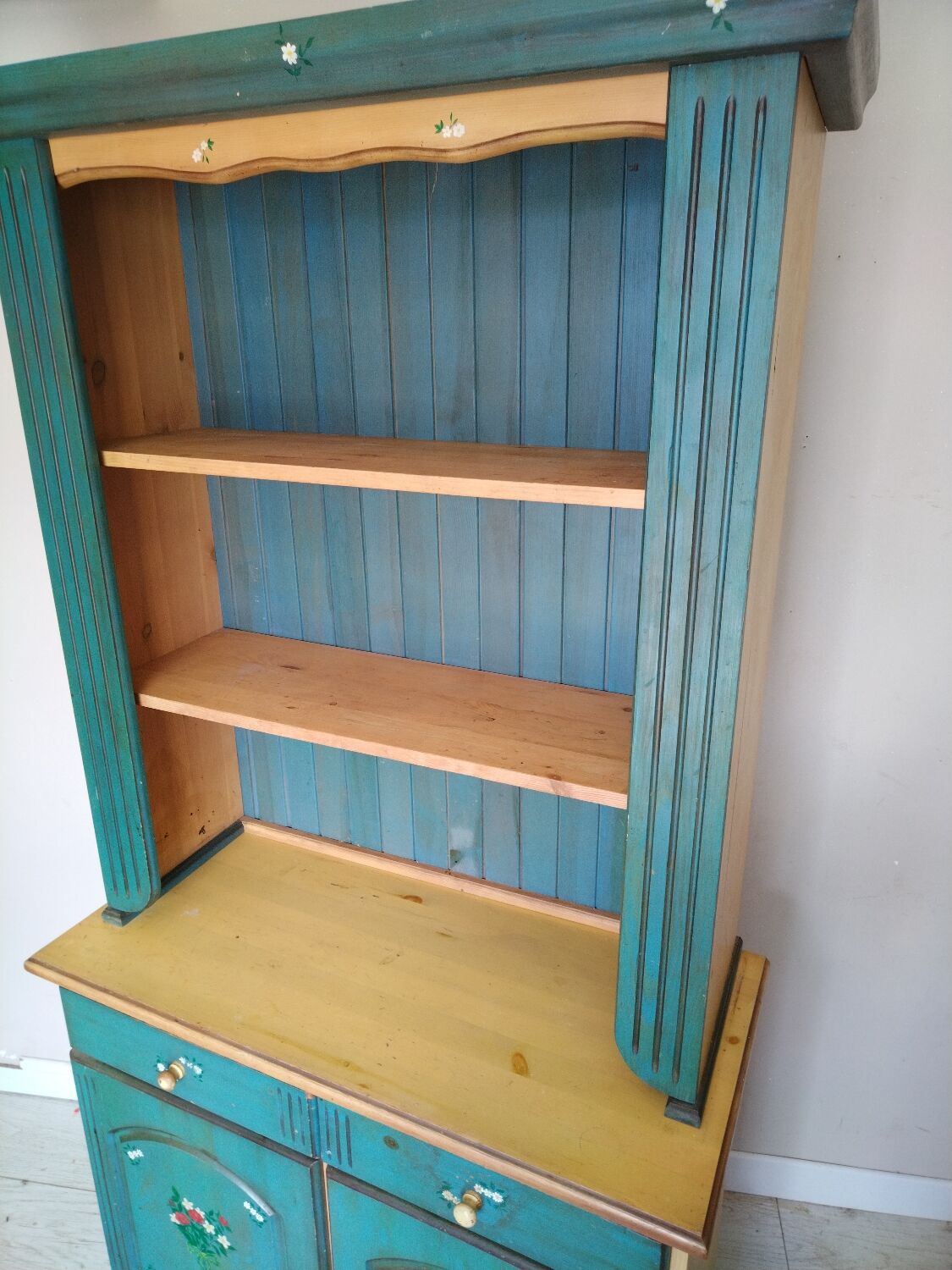Rustic dresser with floral decor