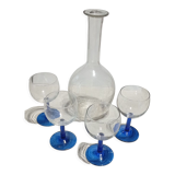 Old carafe and its wine glasses