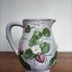 Barbotine pitcher with pastel flower decoration