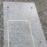 Vintage coffee table in gold and blackened metal with glass top from the 60s