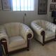 Pair of leather Chesterfield armchairs