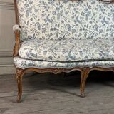 Louis XV bench in carved wood with oak patina, 18th century