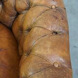 Fauteuil chesterfield sur roulettes en cuir de mouton