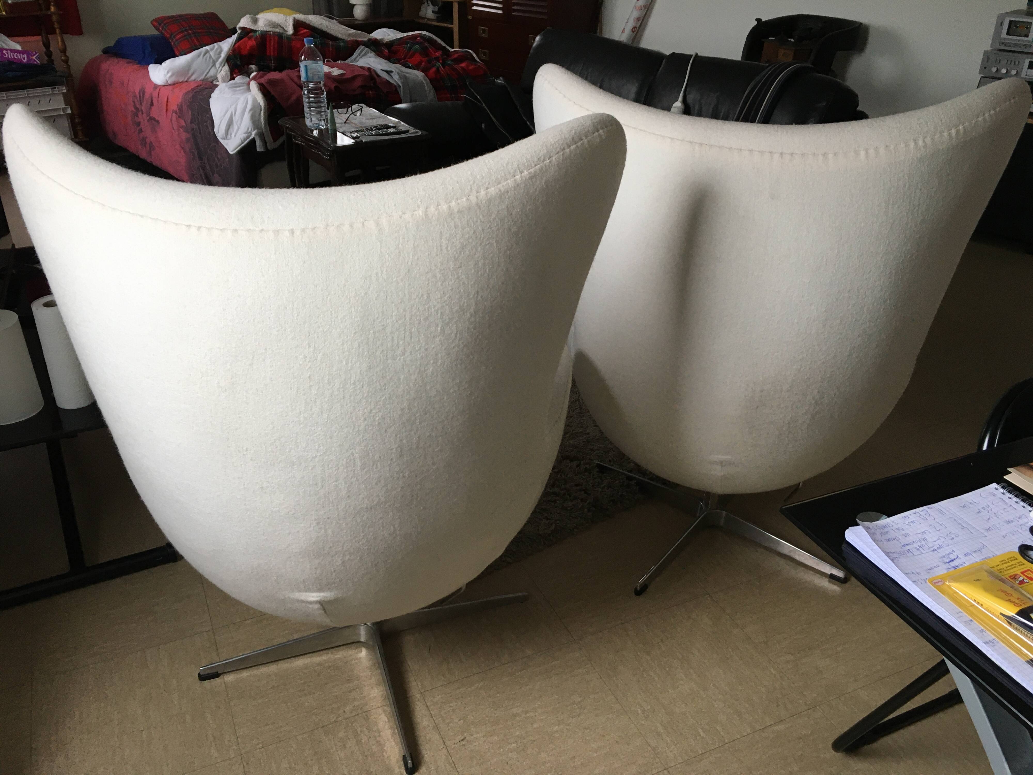 2 white felt egg chairs