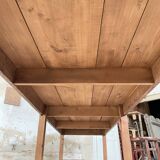 Solid wood workshop table with straight legs.