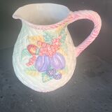 Glazed ceramic slip jug with vintage basket and fruit motif