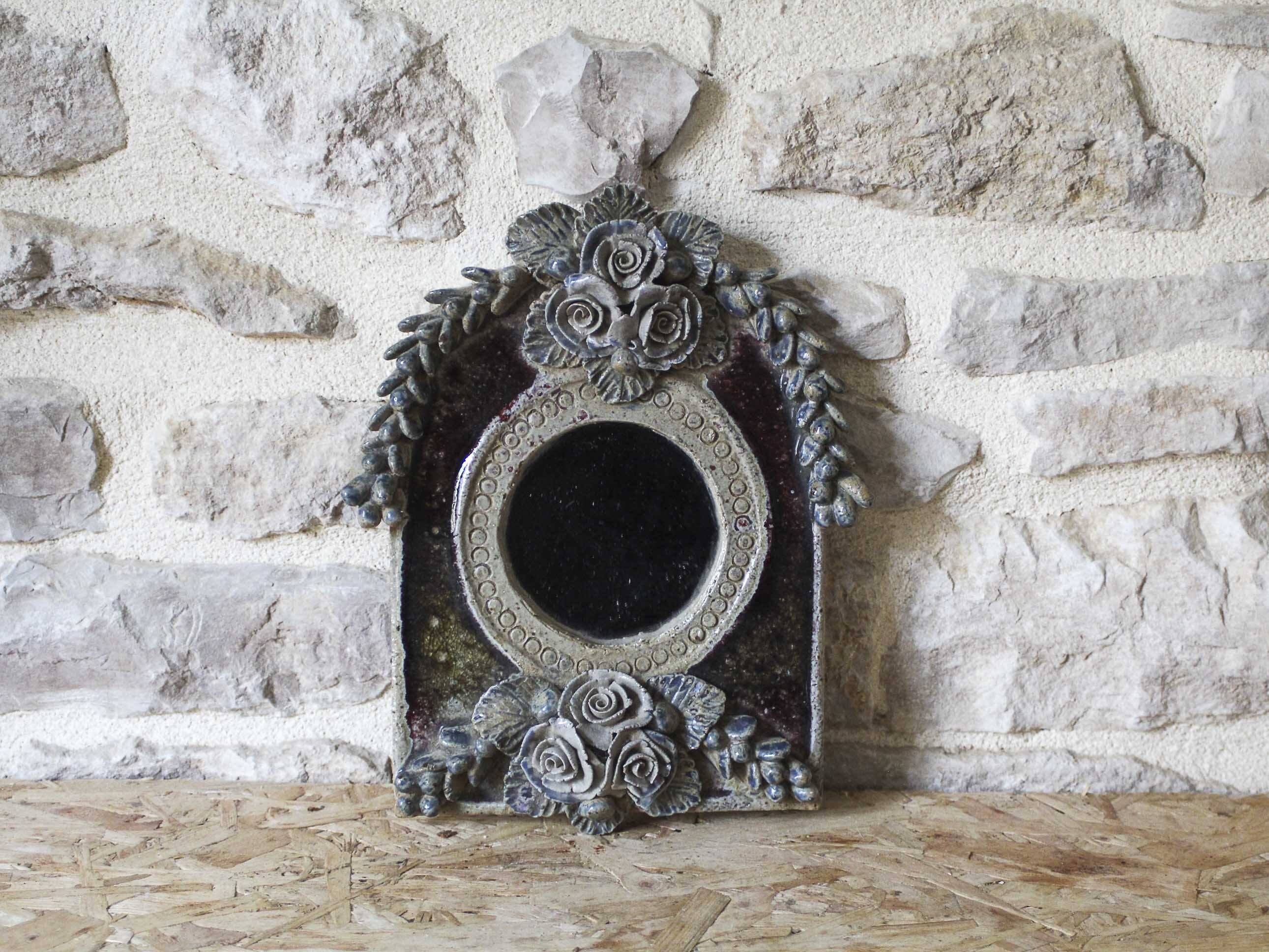 Ceramic mirror decorated with flowers