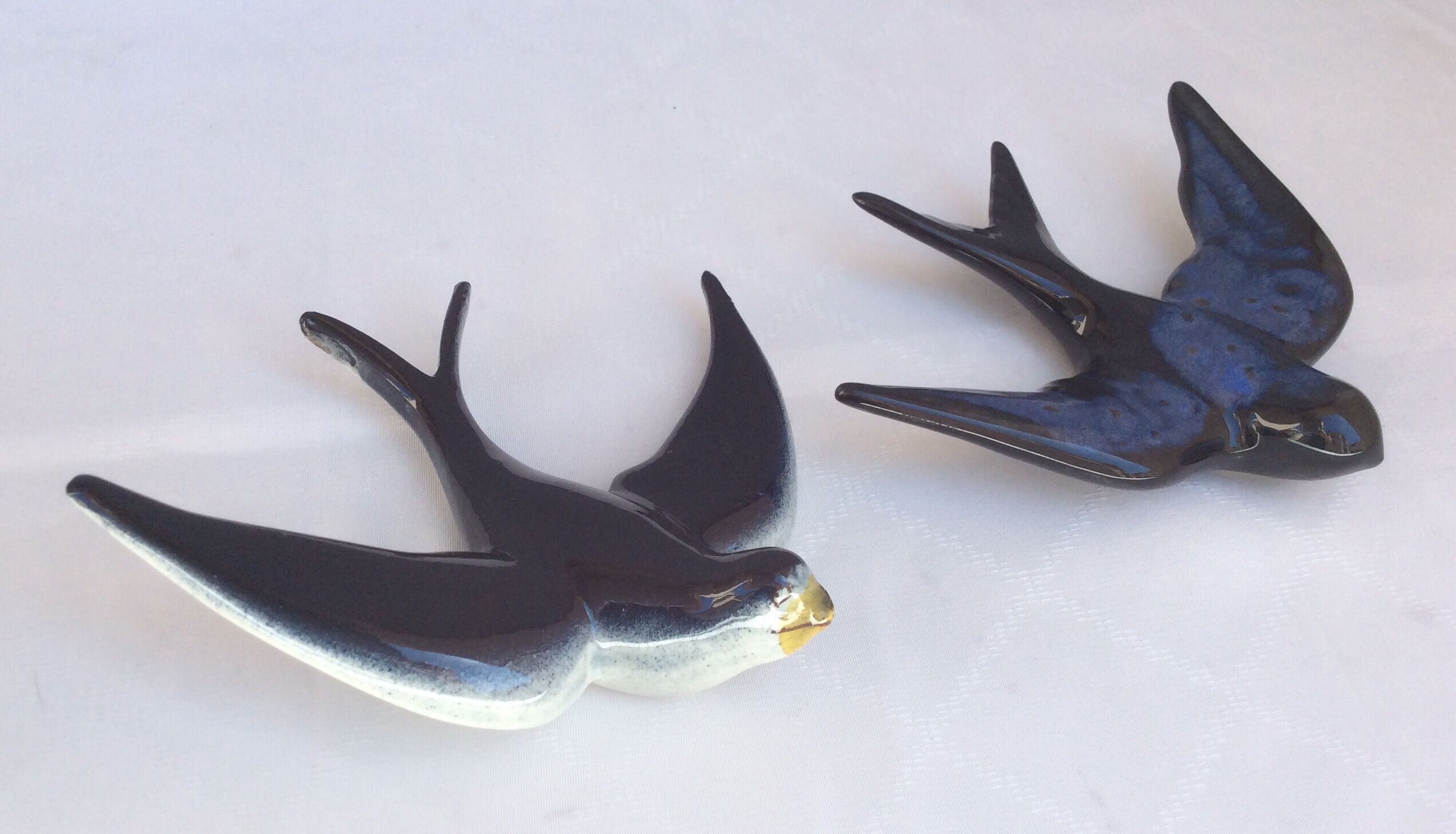 Two ceramic wall swallows