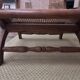 Colonial planter's armchair in solid teak, scroll armrests, caned seat.