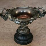 Patinated bronze cup, richly decorated with foliage and bunches of grapes