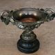 Patinated bronze cup, richly decorated with foliage and bunches of grapes