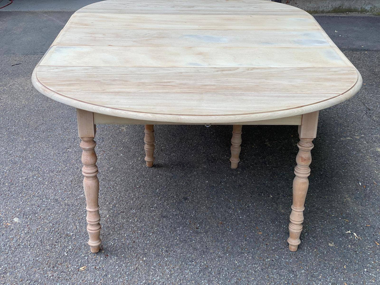 Renovated Louis Philippe round extendable dining table with flaps and 3 extensions.