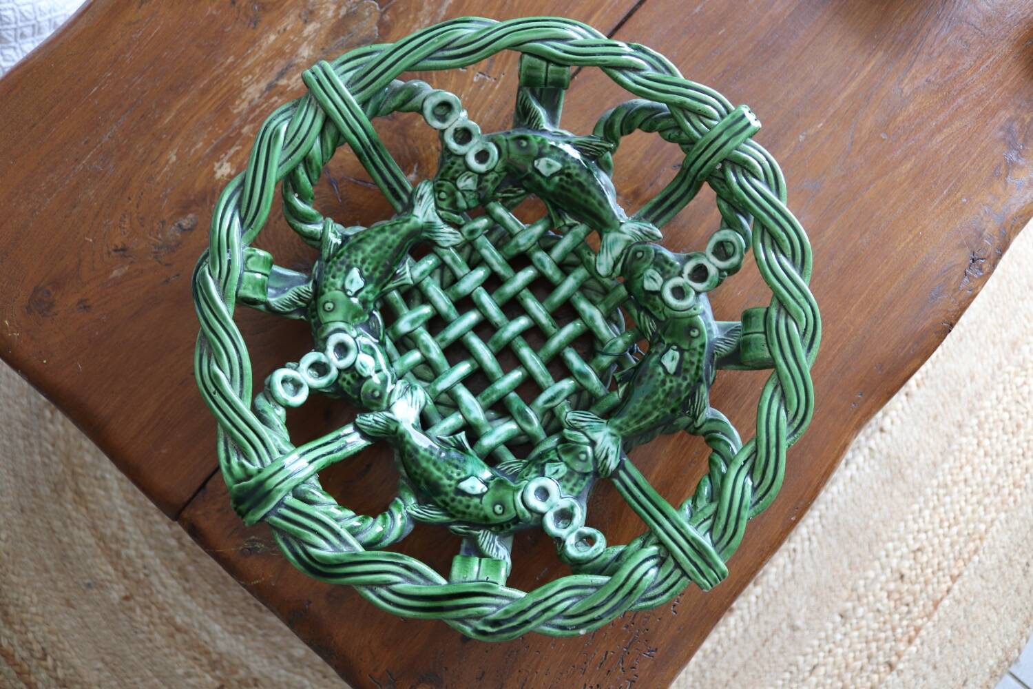 Antique woven basket in green glazed ceramic, fish decoration