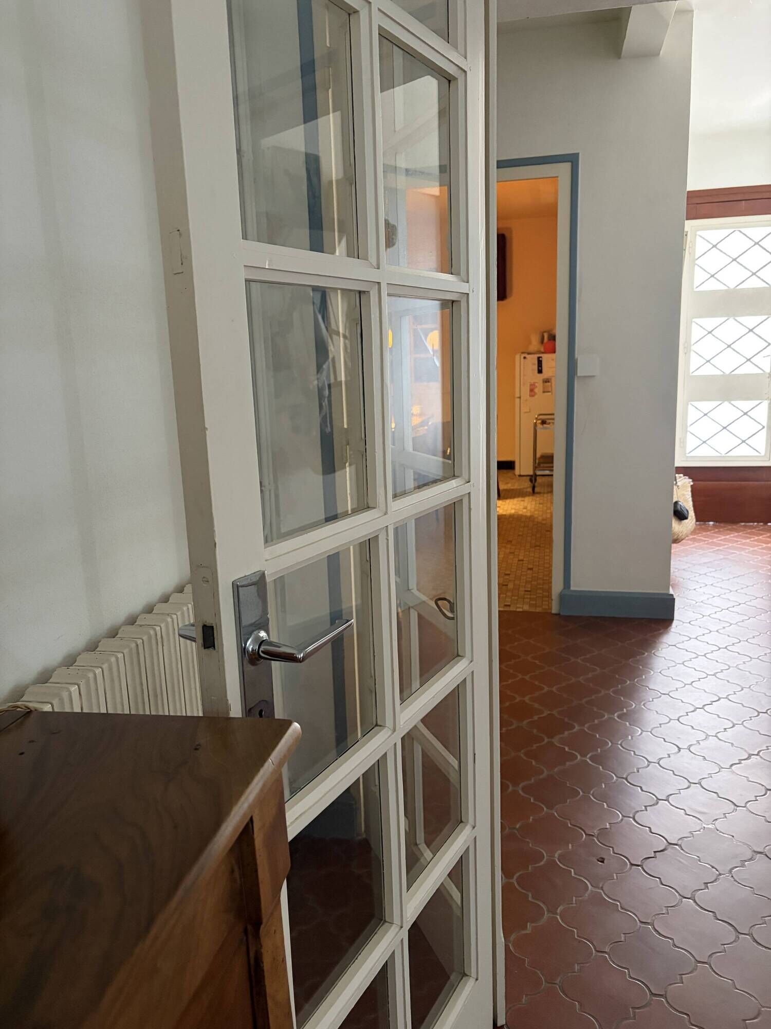 Triptych glass door with three panels featuring small panes. Vintage.