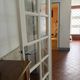 Triptych glass door with three panels featuring small panes. Vintage.