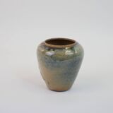 Small beige glazed ceramic vase with abstract relief pattern