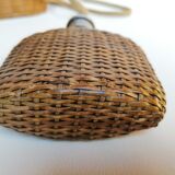 Trio of woven wicker bottles
