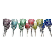 Set of twelve glasses in crystal tinted in different colours and cut with stars.