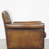 Sheepskin leather armchair with character and a touch of Art Deco design
