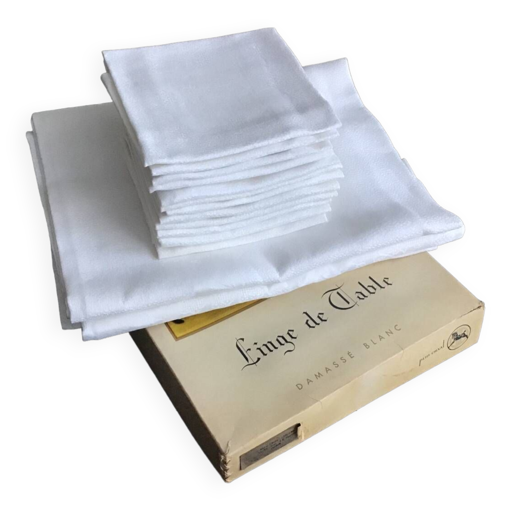 White damask table service consisting of a large tablecloth and 12 napkins