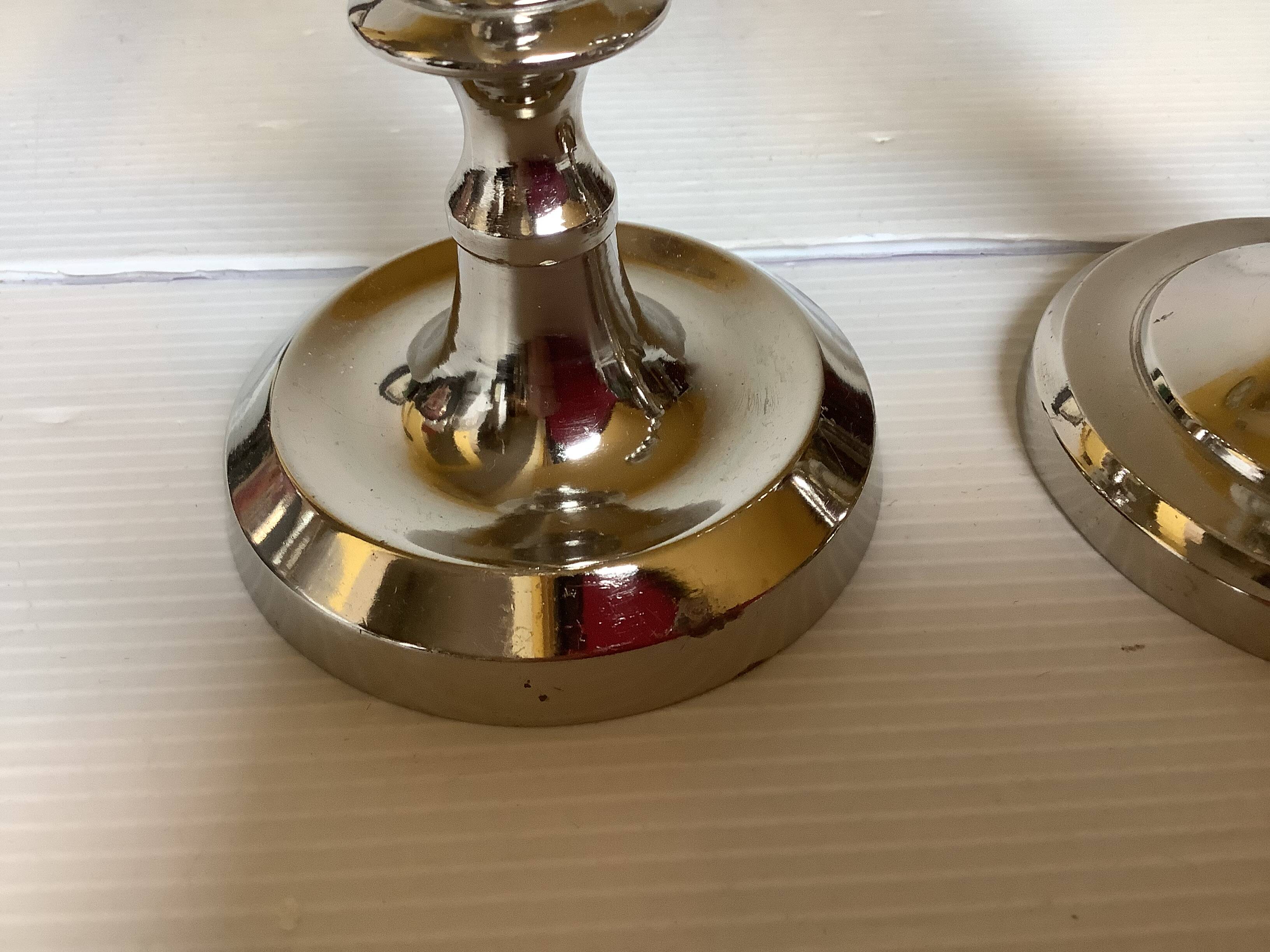 Pair of silver metal candlesticks