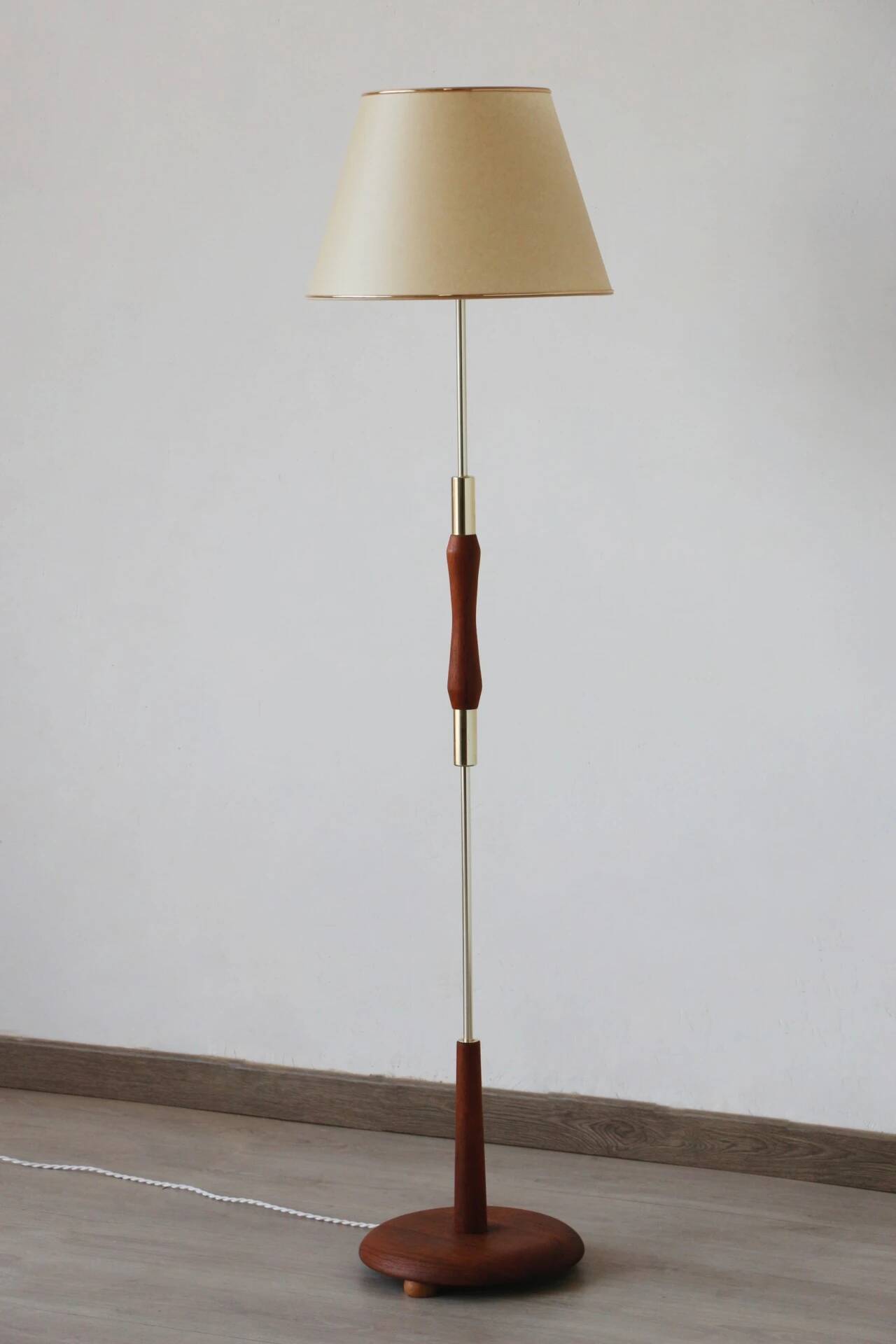 Vintage 1960s Scandinavian style floor lamp in teak and brass.