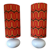 Two lamps with a seventies psychedelic wave print.