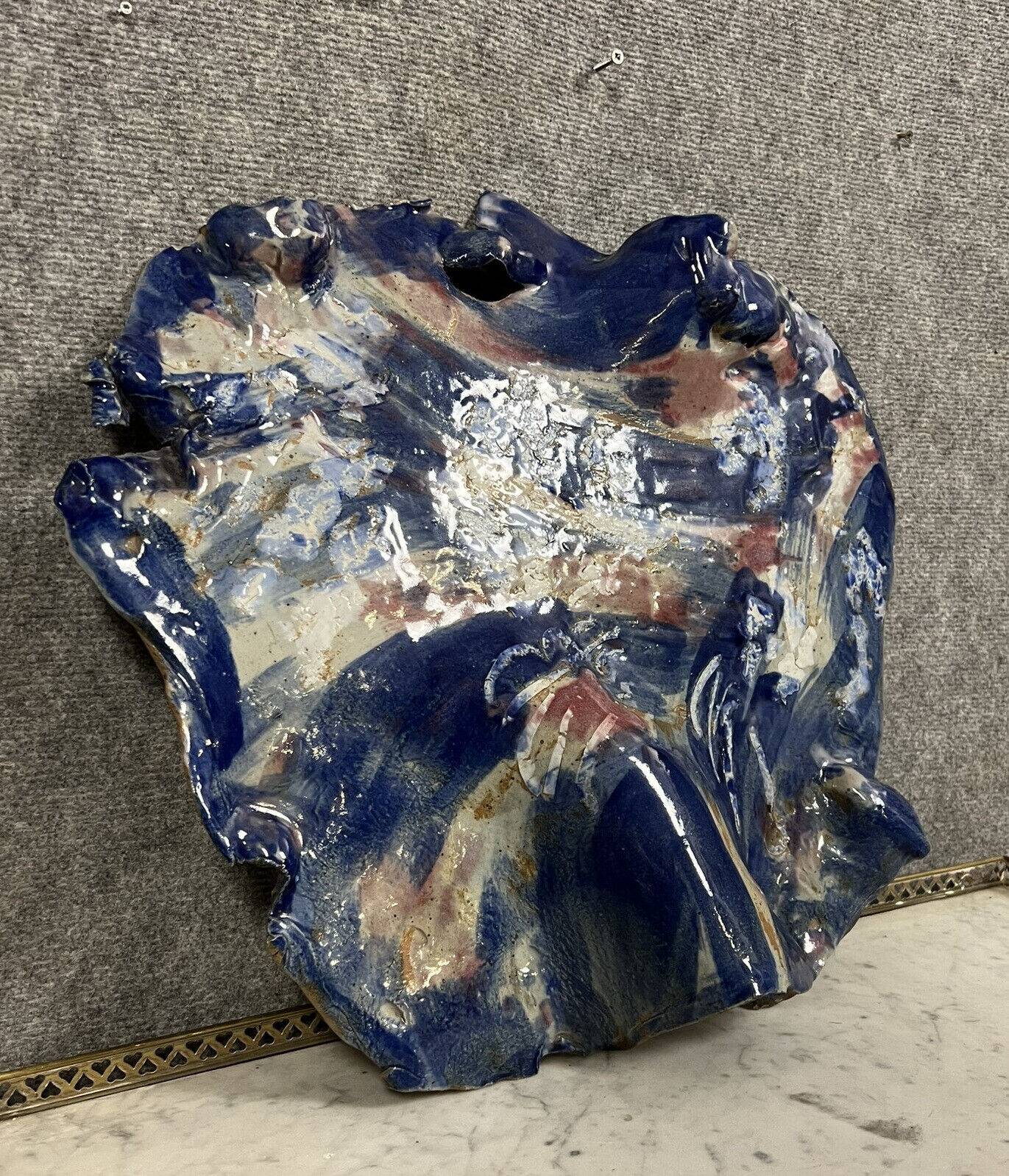 Dish Sculpture in enamelled terracotta with a blue background