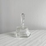 Small transparent faceted glass bottle