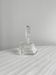 Small transparent faceted glass bottle