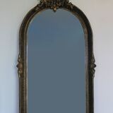 Baroque “trumeaux” mirror in carved solid wood.