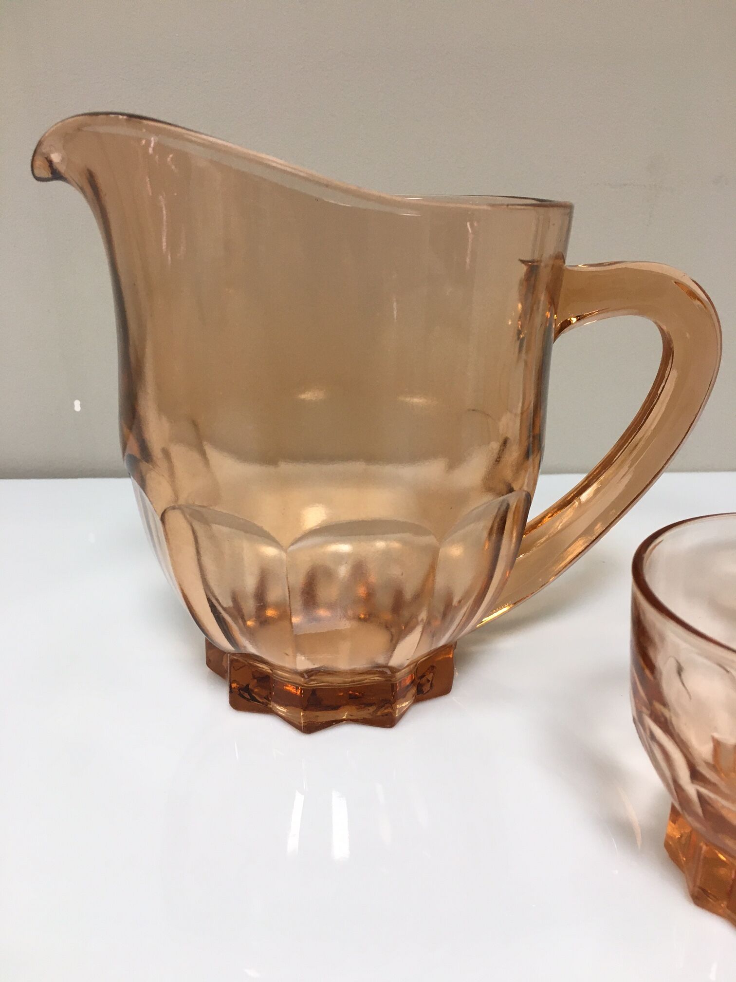 Orange pitcher and 4 rosaline glasses