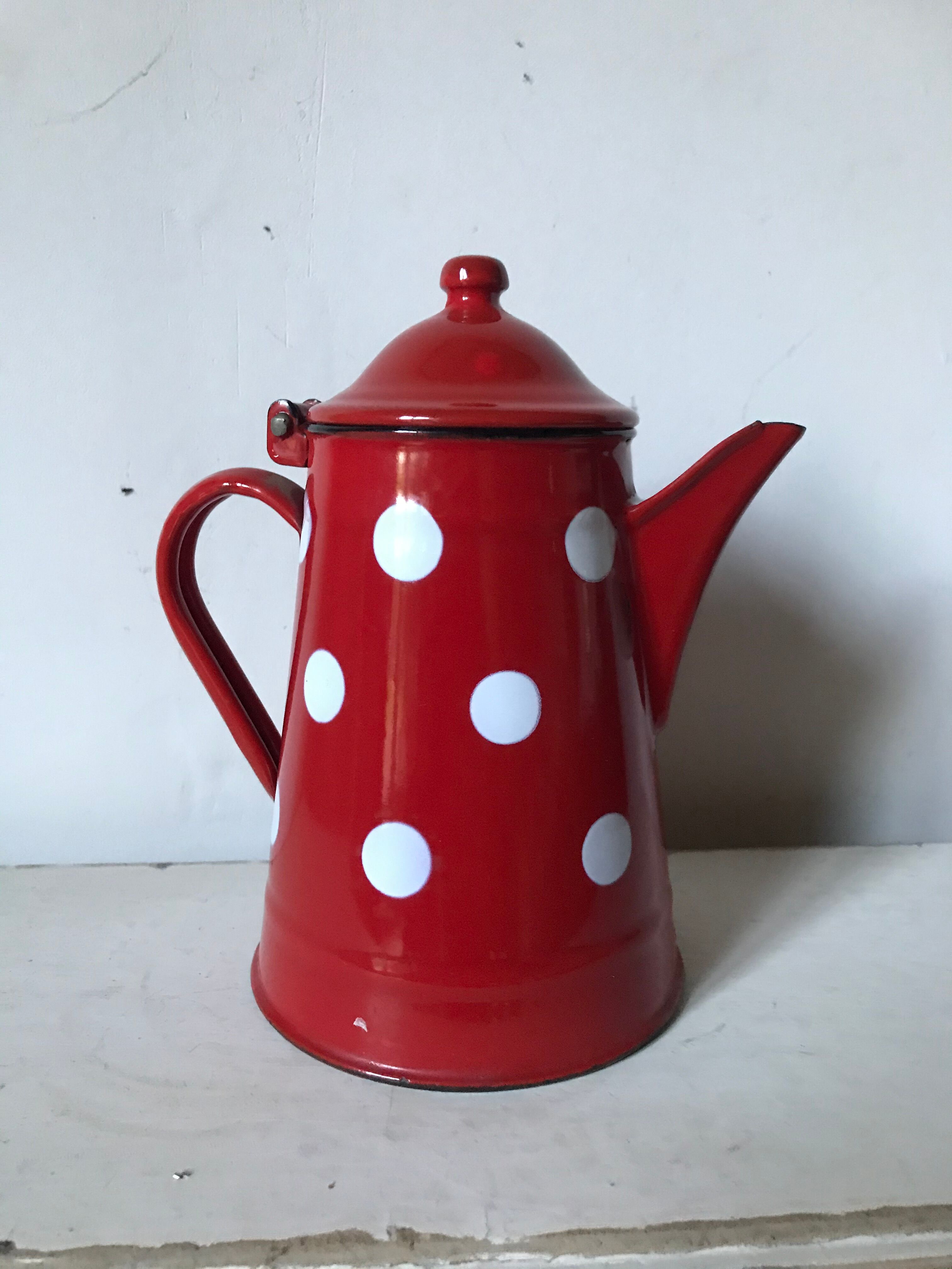 Red enamelled coffee maker with white polka dots