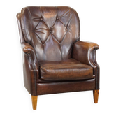 Vintage sheepskin armchair in a dark cognac colour with a comfortable seat