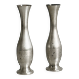 2 shiny metal vases