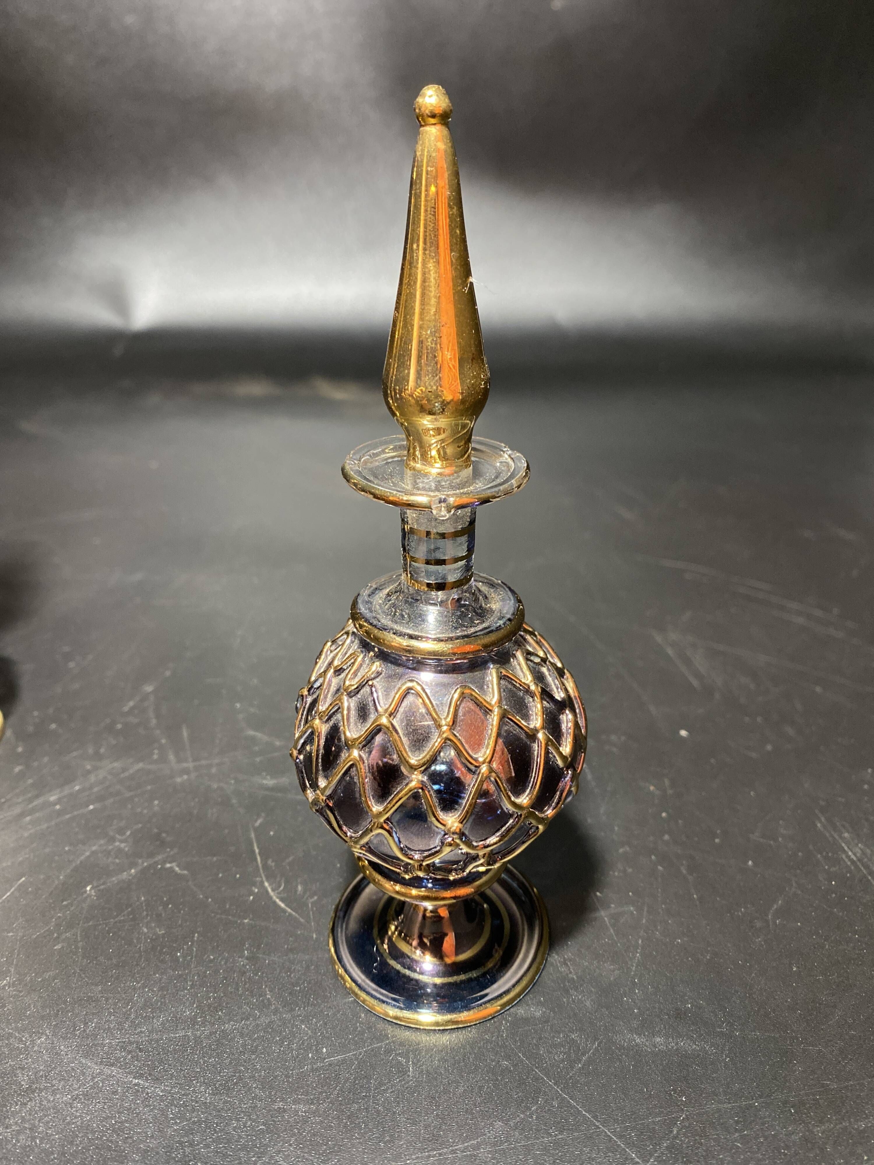 Set of 8 blown glass perfume bottles gilded with 12 carat gold