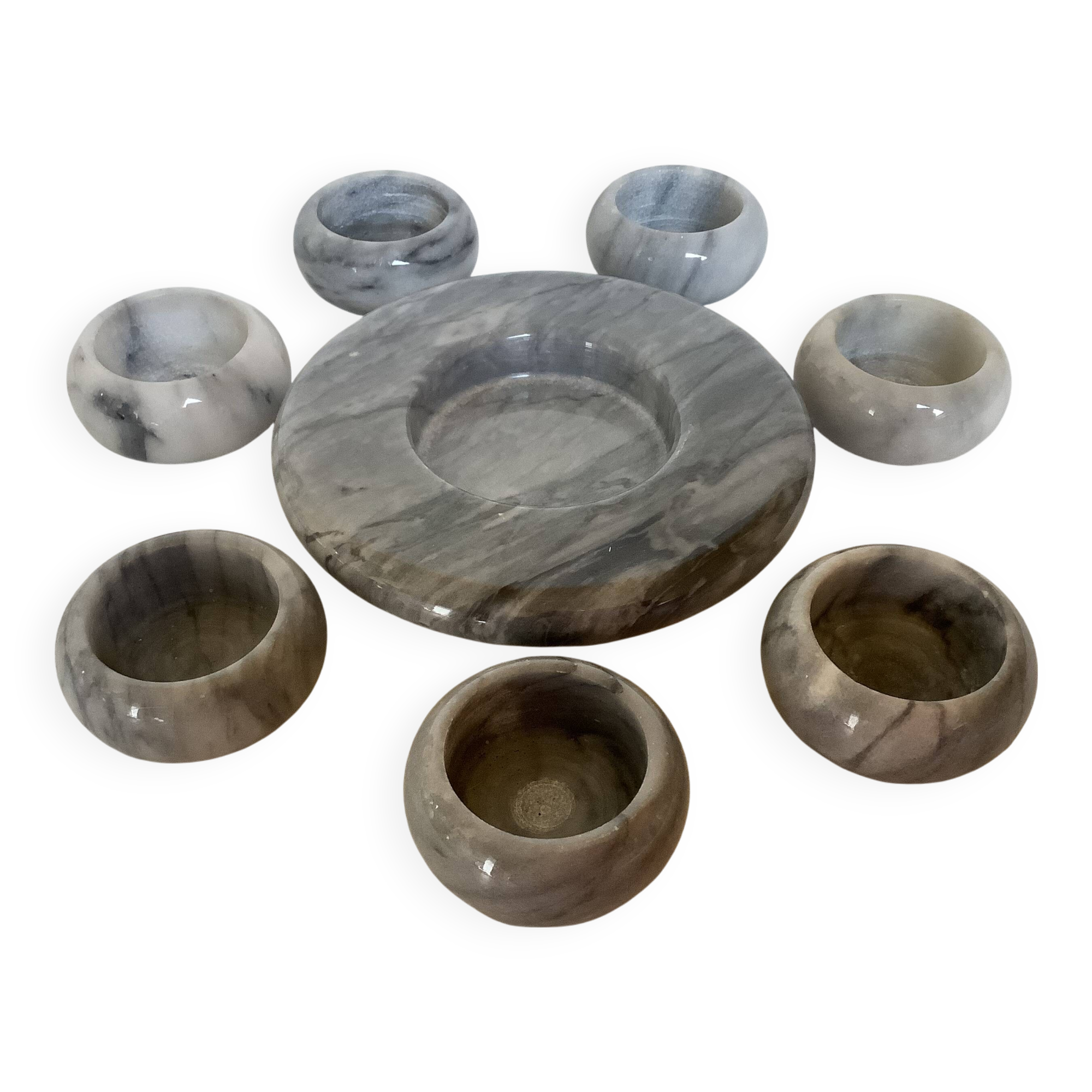 Eight grey-white marble candlesticks