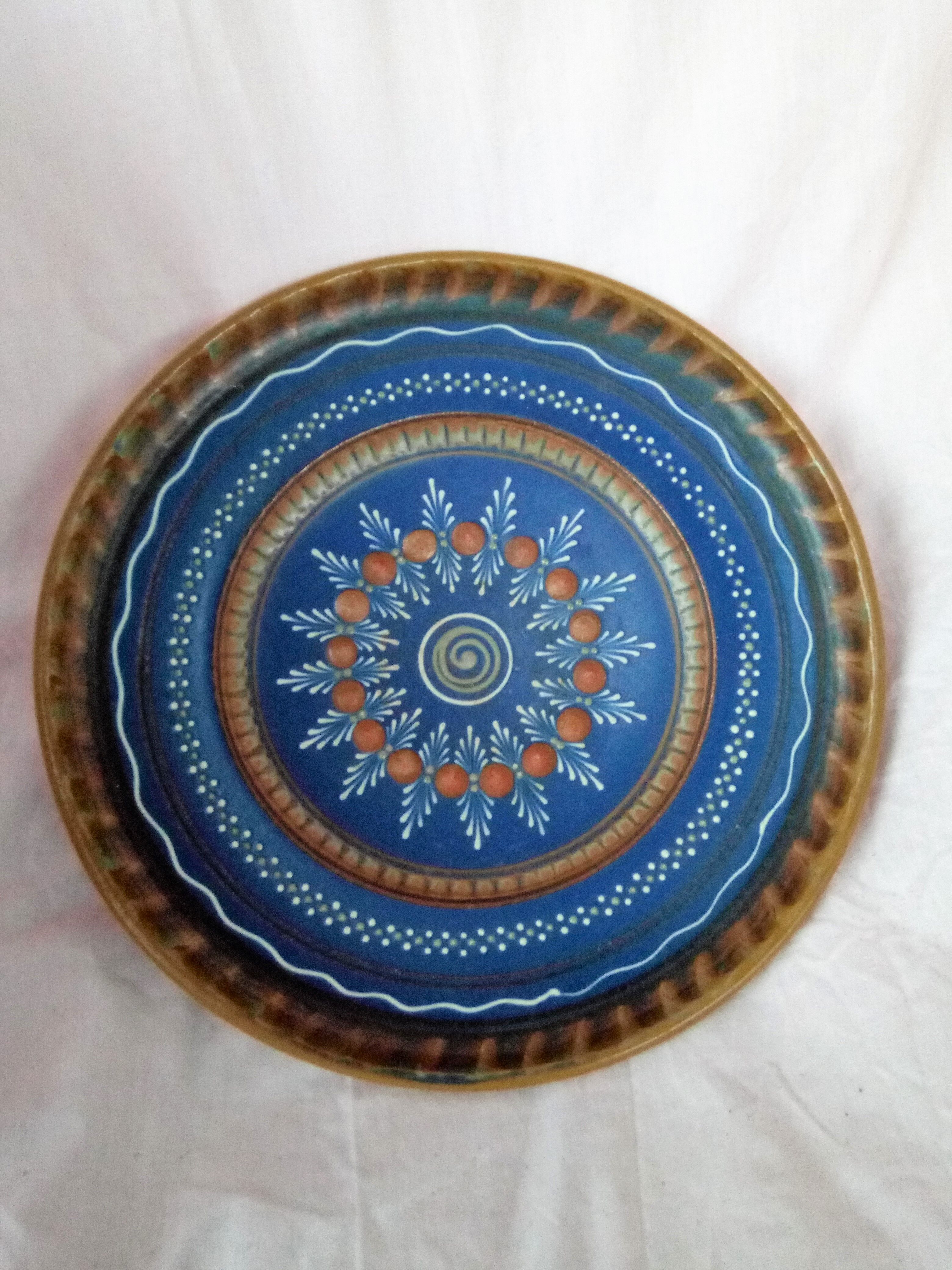 Plate in painted sandstone
