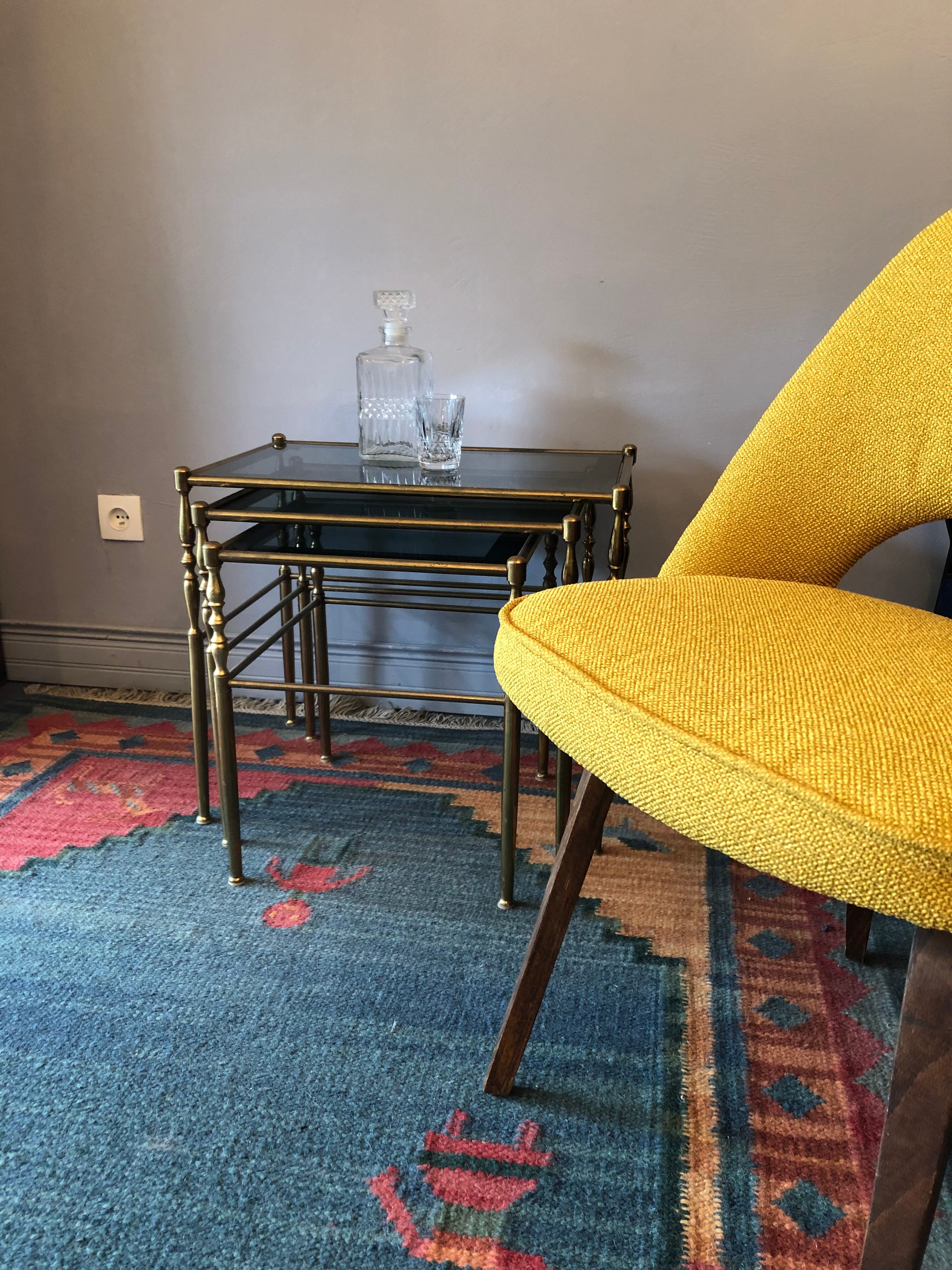 Brass tables and smoked glasses