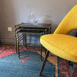 Brass tables and smoked glasses