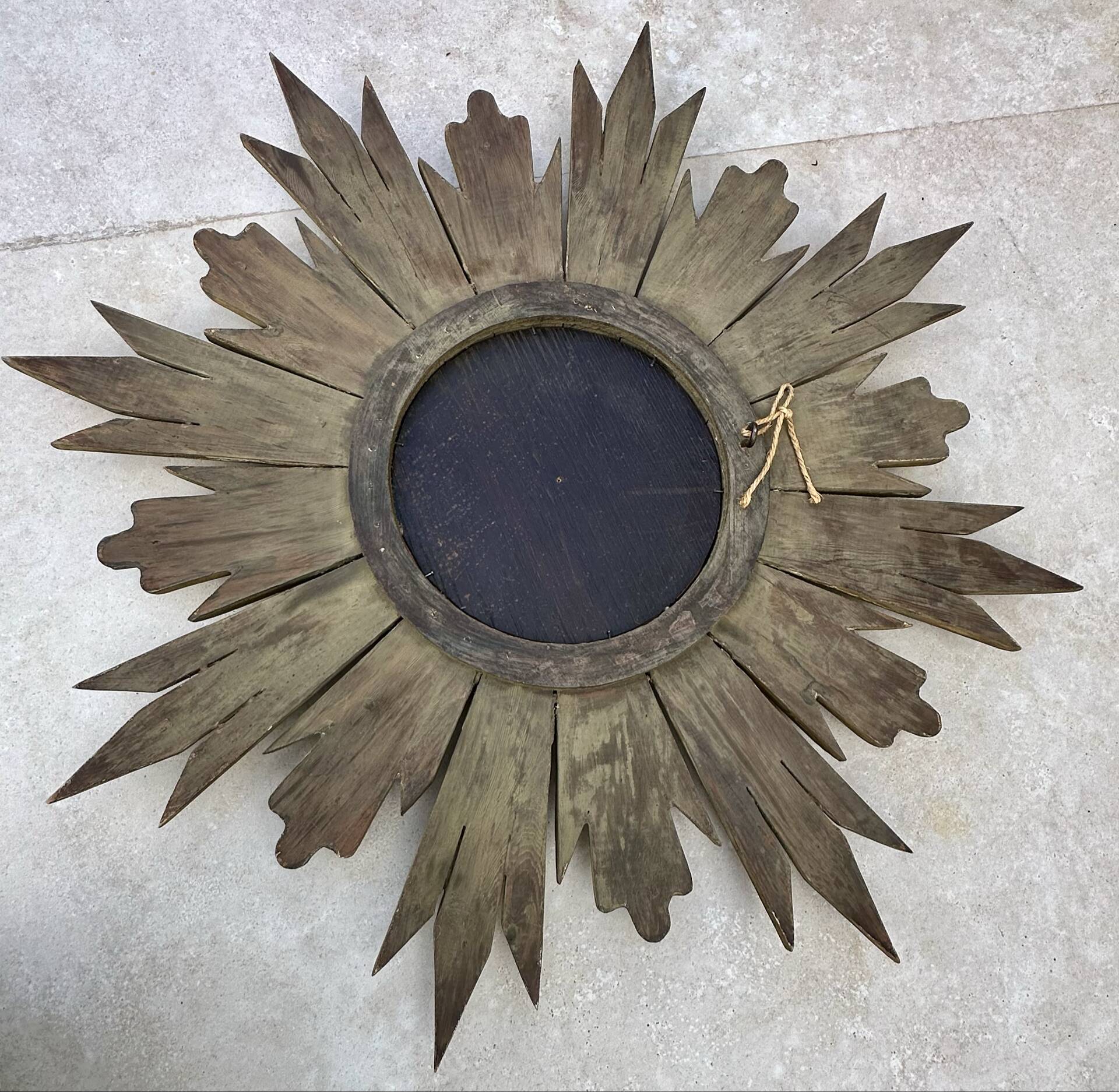 Large sun mirror in carved gilded wood.