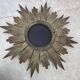 Large sun mirror in carved gilded wood.