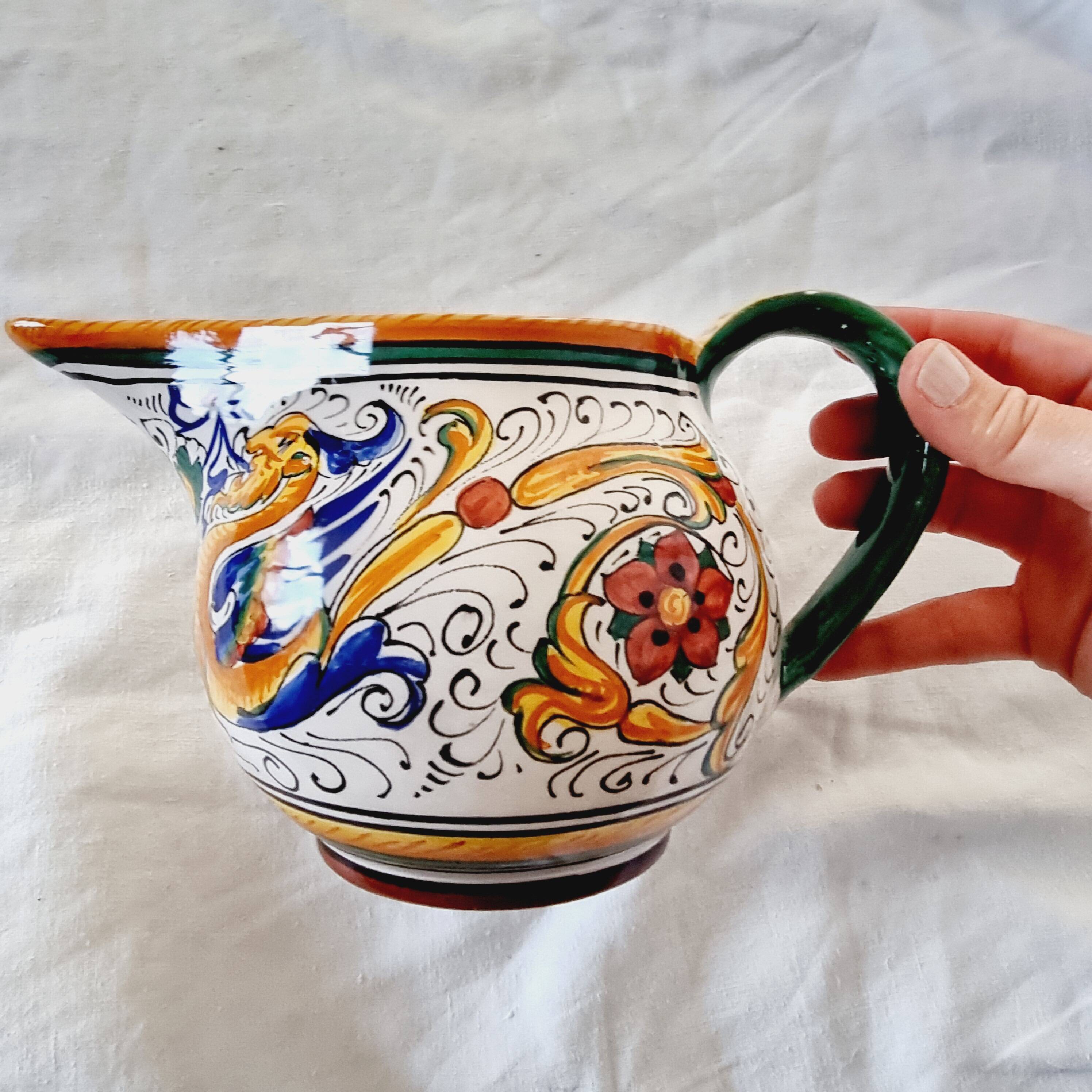 Majolica ceramic jug by R. Deruta, Italy, hand-painted, with a long spout.  Decorated with a dragon tree