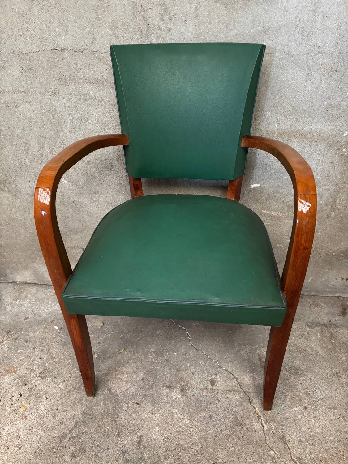 Green faux leather bridge chair