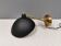 A wall lamp in black and brass-coloured finishes. Danish, early 2000s.
