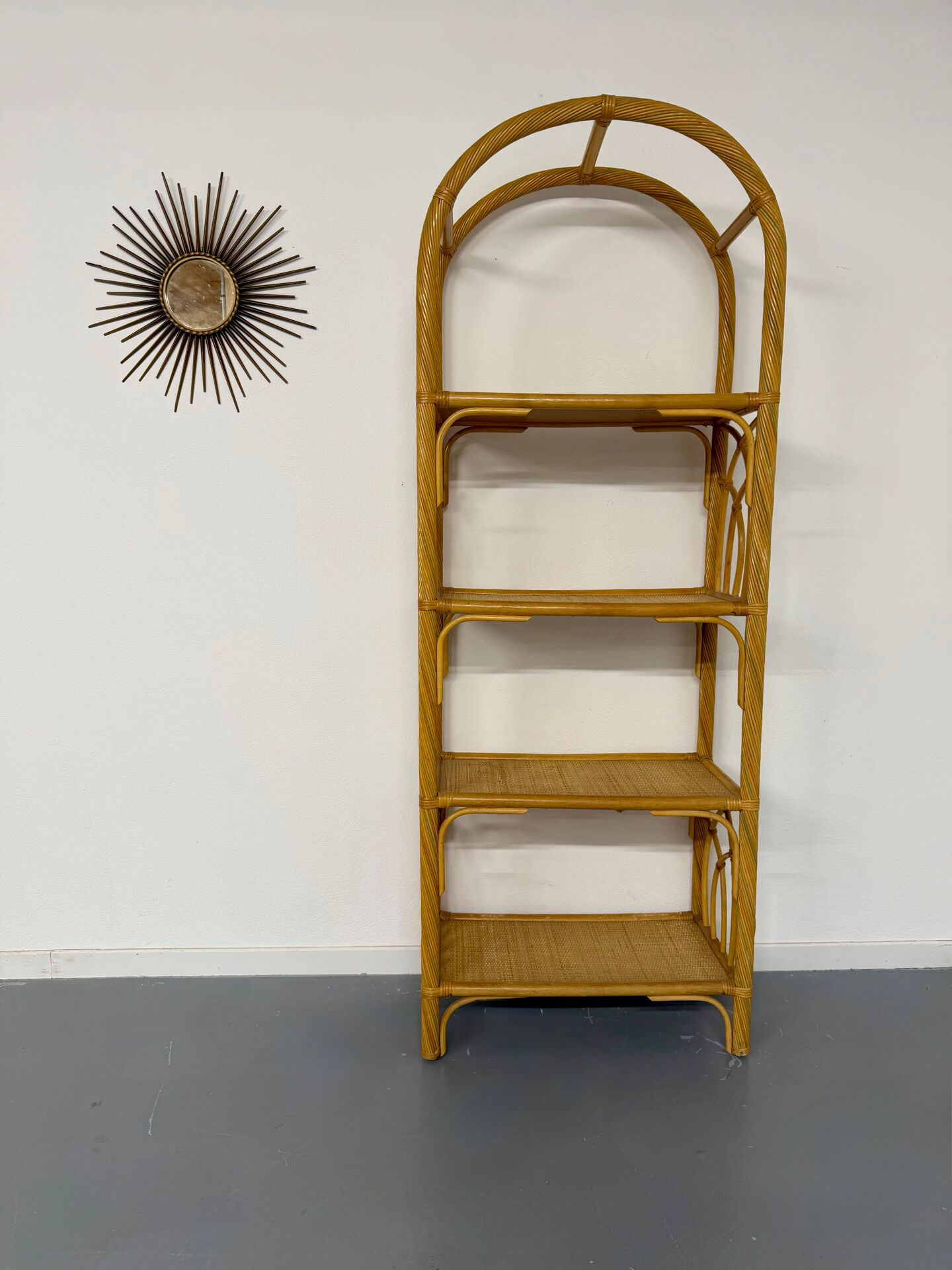Large woven rattan bookshelf designed in the 1970s.