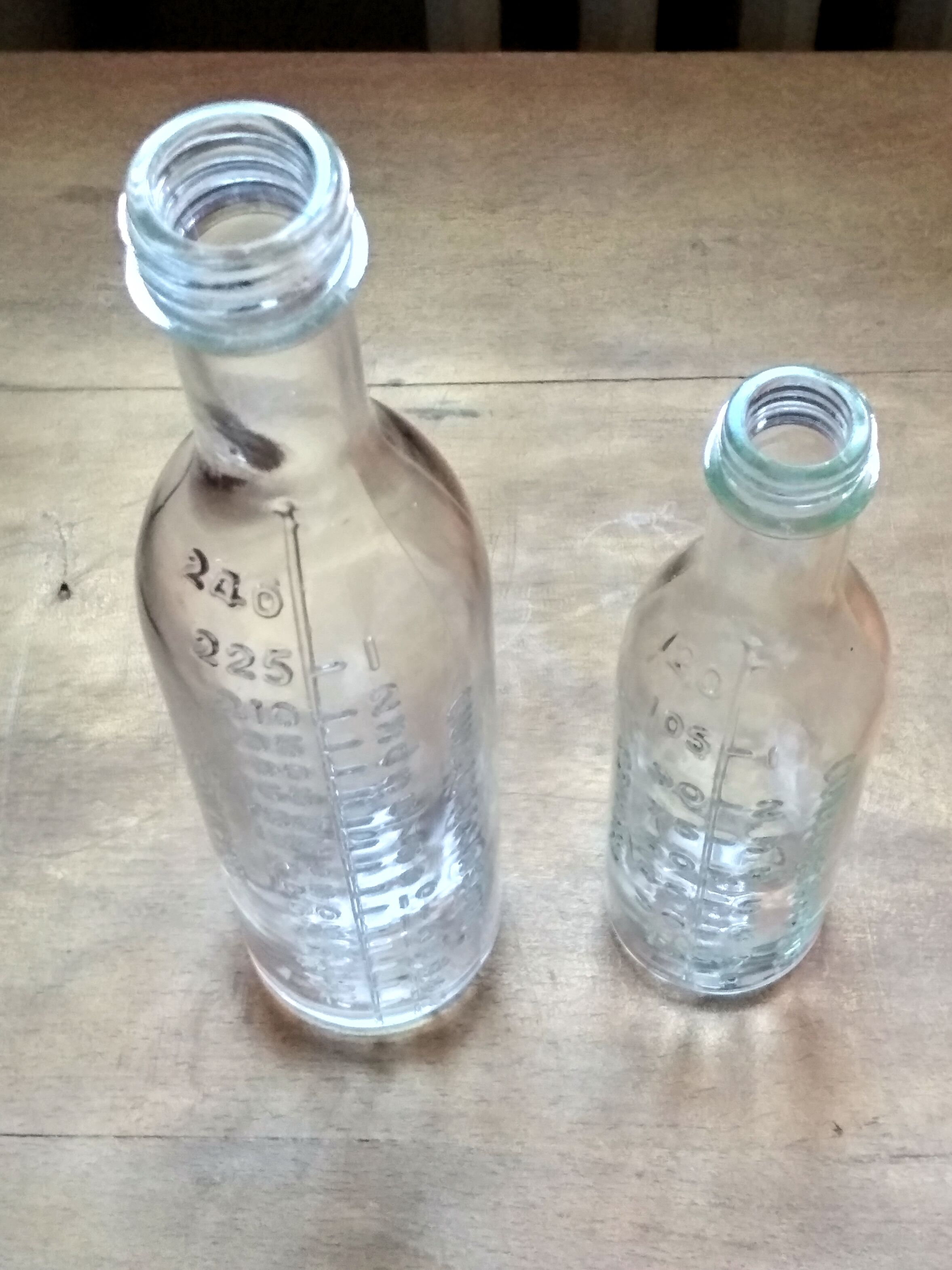 2 old graduated pharmacy bottles